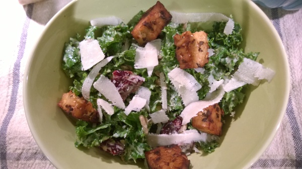kale salad with creamy cashew dressing, tempeh croutons and shaved pecorino
