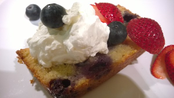 Blueberry Lemon Tea Cake with whipped cream and berries