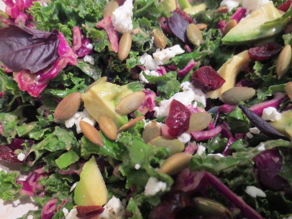 Green Kale and Purple Cabbage dressed with Avocado Fresh Herb Dressing, Cranberries, Basil, Avocado, Goat Cheese, yum!