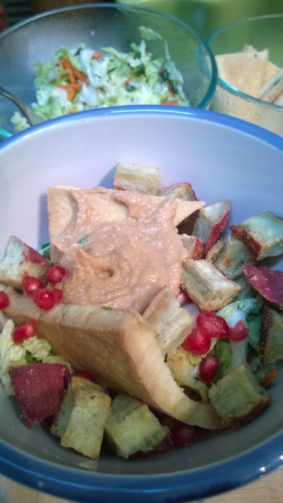 Ginger roasted sweet potatoes with cabbage slaw and tahini peanut lime tofu