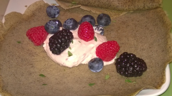 Crepes filled with fresh berries and cream