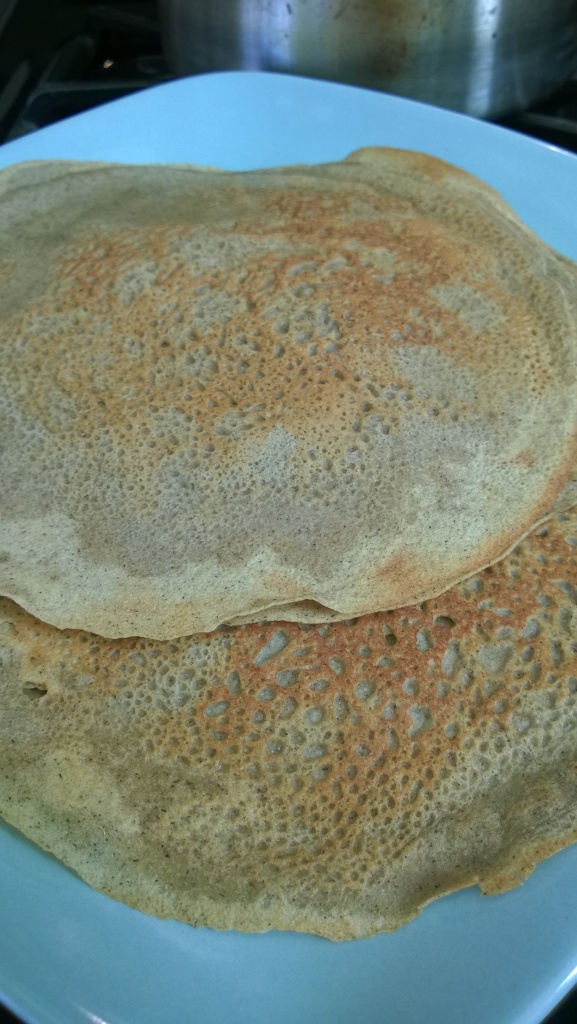 A stack of buckwheat and millet crepes