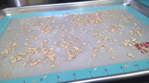 baking sheet sprinkled with oats