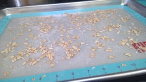 baking sheet sprinkled with oats
