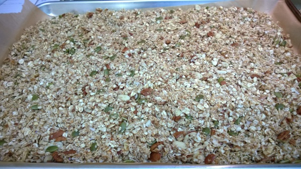Granola pressed into the pan and ready to be baked